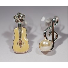Different earrings: violin and G clef. Silver color